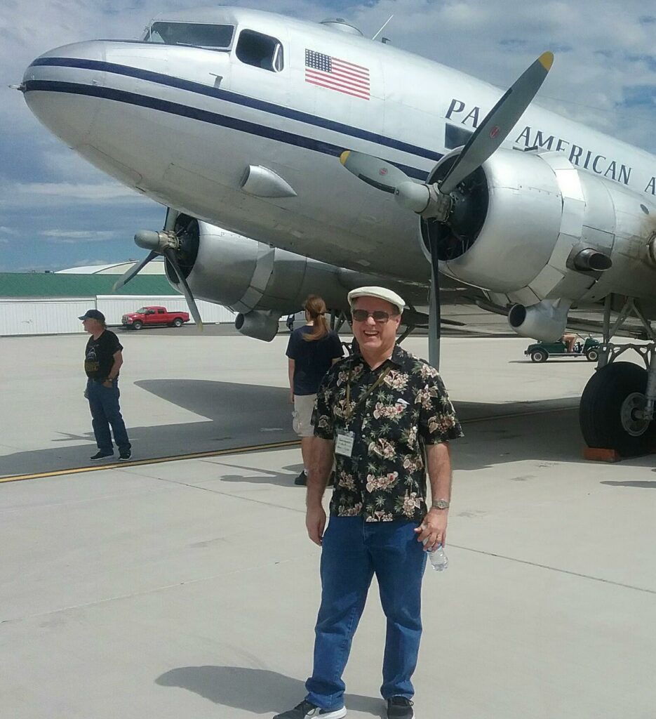 The author standing in front of a silver DC-3 at Felts Field, Spokane